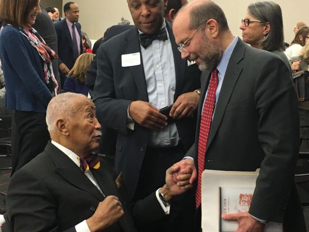 Former Mayor David Dinkins, left, and Human Resources Administration Commissioner Steve Banks, right, chat after Banks' speech at the New York Law School.