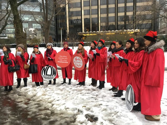 The Nasty Women's Choir sings against President-elect Donald Trump's anti-reproductive rights stance in front of Trump International Hotel. 