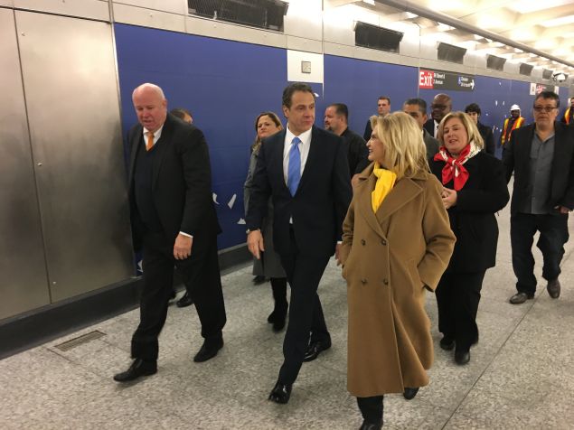 Elected officials walking through the 96th Street Station of the Second Avenue Subway line.