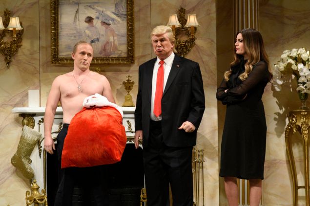 Beck Bennett as Russian President Vladimir Putin, Alec Baldwin as Donald Trump, and Cecily Strong as Melania Trump. 