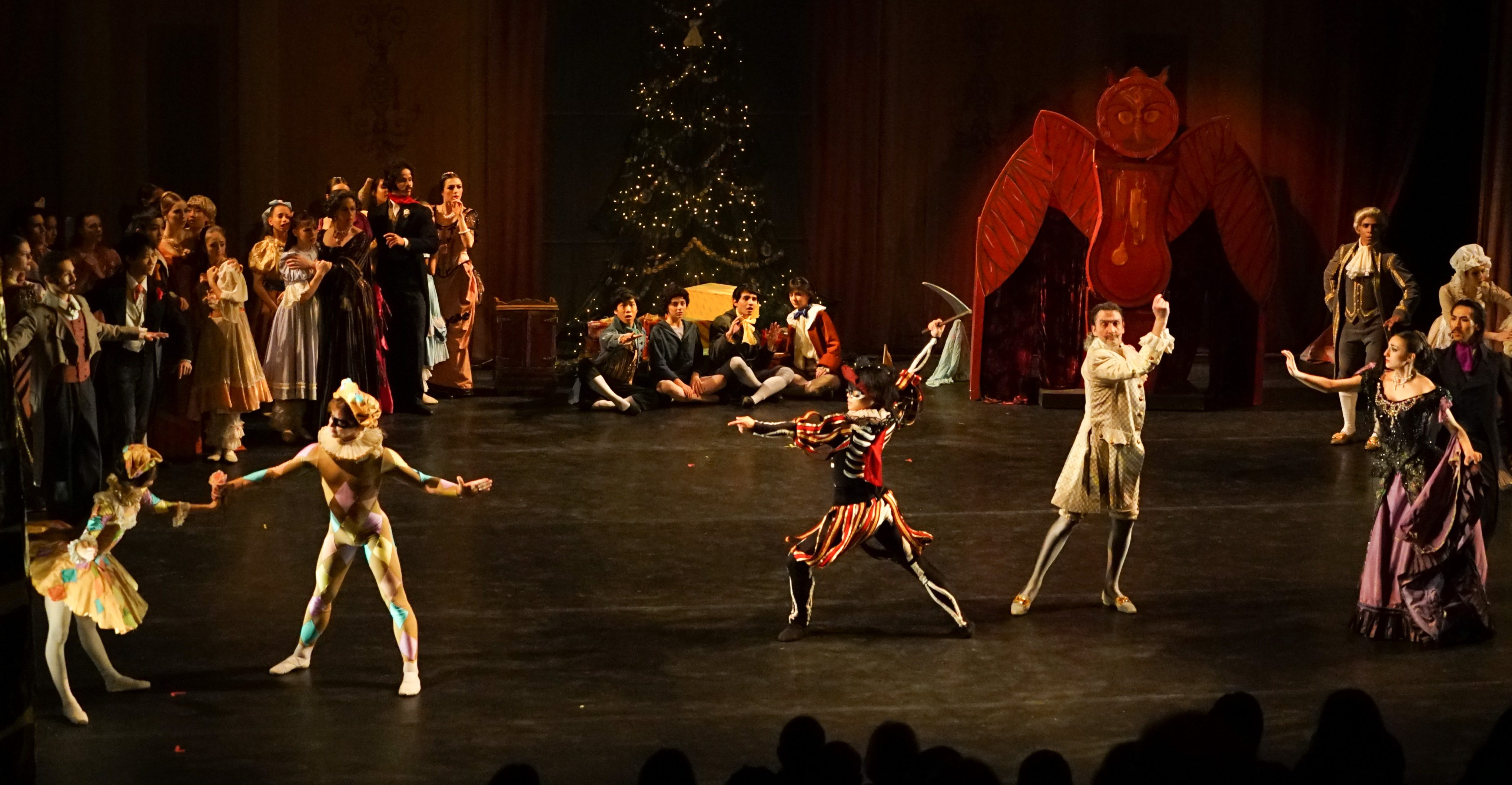 Gelsey Kirkland Ballet's "The Nutcracker" - Act 1 party scene Doll dance with Akop Akopian as Drosselmyer, Erez Milatin as Harlequin, Nina Yoshida as Columbine, Kaito Yamamoto as “Mortal Time”.