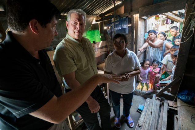 Al Gore with former Mayor of Tacloban City Alfred Romualdez and Typhoon Haiyan survivor Demi Raya, in the Philippines, from An Inconvenient Sequel: Truth to Power