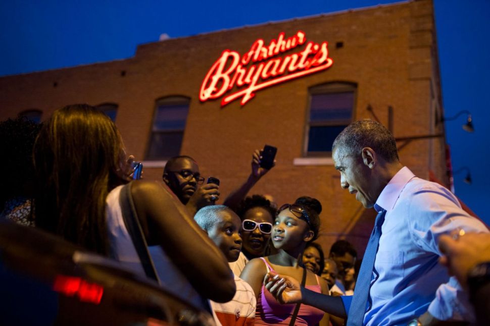 The President greeting people outside Arthur Bryant's Barbeque in Kansas City on July 29, 2014. 