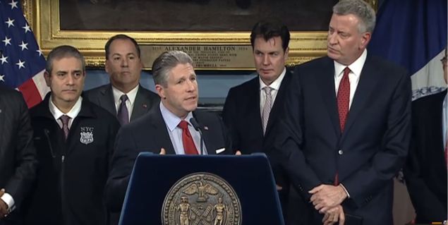 PBA President Patrick Lynch, center, alongside Mayor Bill de Blasio.