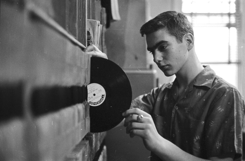 Dean Calagno is one of the youngest radio disc jockeys in America and attracts a large teenage audience. Although he has only one show a week, Dean does a great deal of research during the week to be sure which records are exactly right for his playlist. (Photo by Orlando /Three Lions/Getty Images)