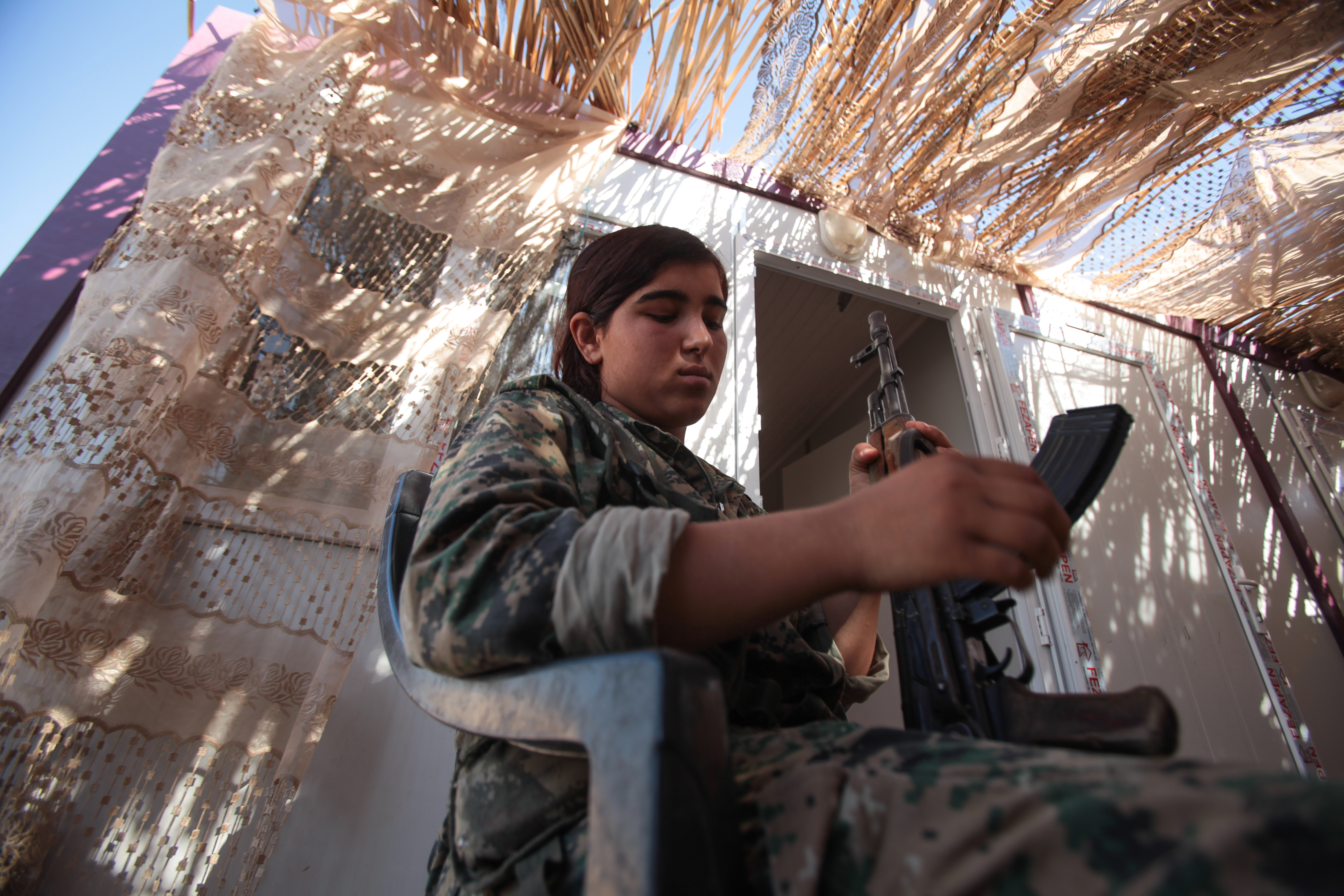 A Kurdish YPG fighter in a camp at the outskirts of the destroyed Syrian town of Kobane, also known as Ain al-Arab, Syria.