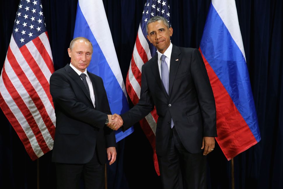 NEW YORK, NY - SEPTEMBER 28: (AFP OUT) Russian President Vladimir Putin (L) and U.S. President Barack Obama shake hands for the cameras before the start of a bilateral meeting at the United Nations headquarters September 28, 2015 in New York City. Putin and Obama are in New York City to attend the 70th anniversary general assembly meetings.