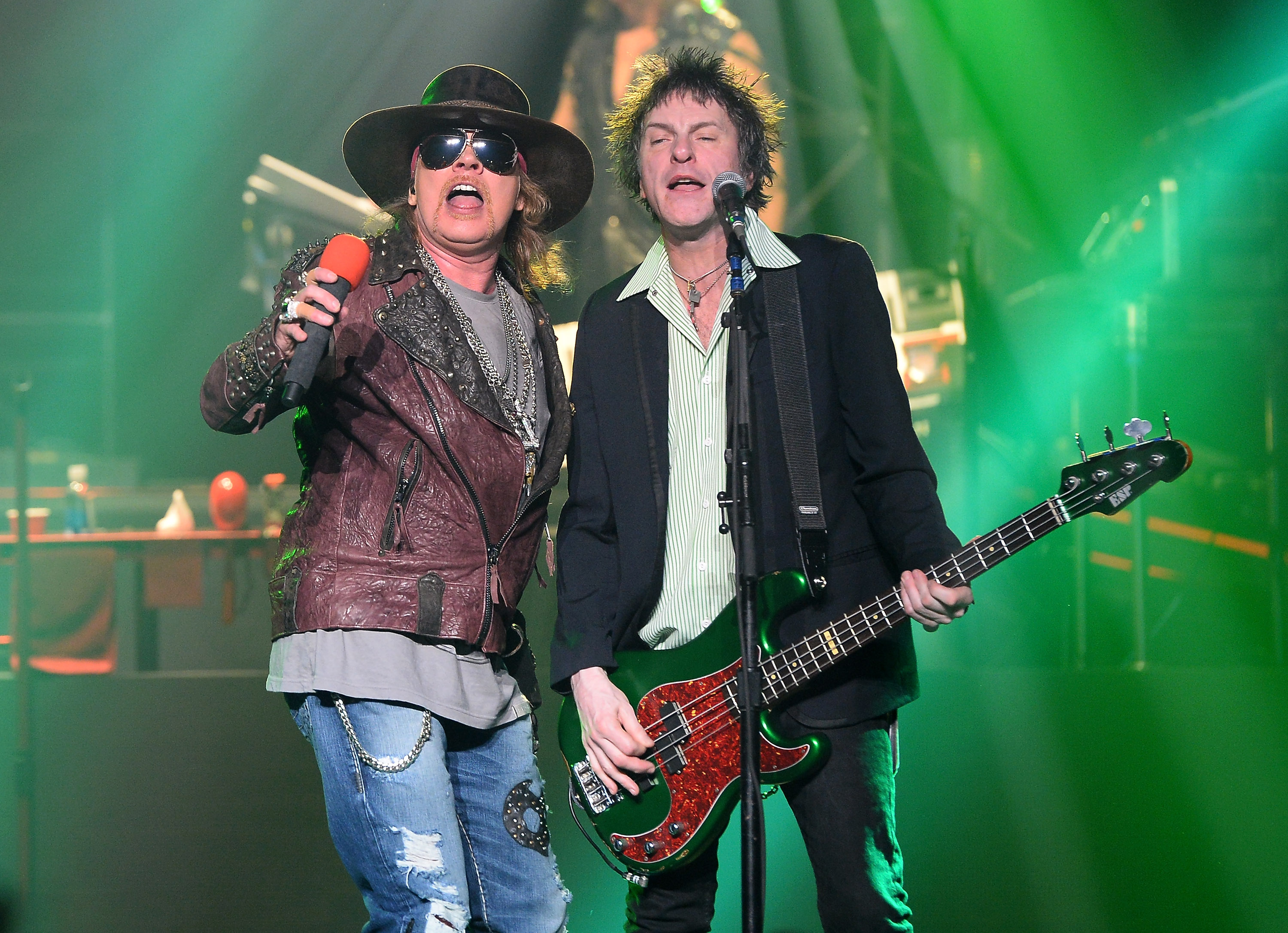 Axl Rose and Tommy Stinson playing with Guns N' Roses. (Photo by Ethan Miller/Getty Images)