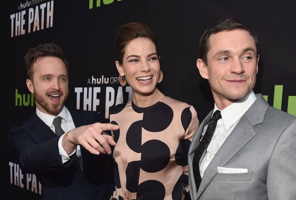 Actors Aaron Paul, Michelle Monaghan and Hugh Dancy arrive during the premiere of Hulu's "The Path," March 21, 2016.