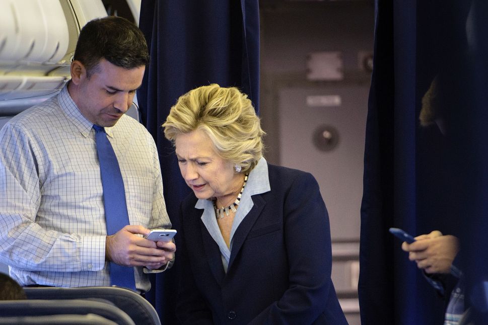 Hillary Clinton with national press secretary Brian Fallon on her plane on October 3, 2016.