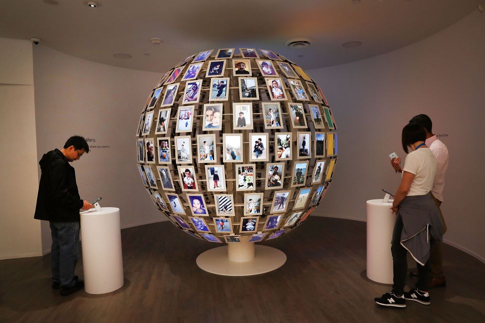 NEW YORK, NY - OCTOBER 20: People visit the new Google pop-up shop in the SoHo neighborhood on October 20, 2016 in New York City. The shop lets people try out new Google products such as the Pixel phone, Google Home, and Daydream VR. The products will be available for purchase offsite at Verizon and Best Buy retail stores.