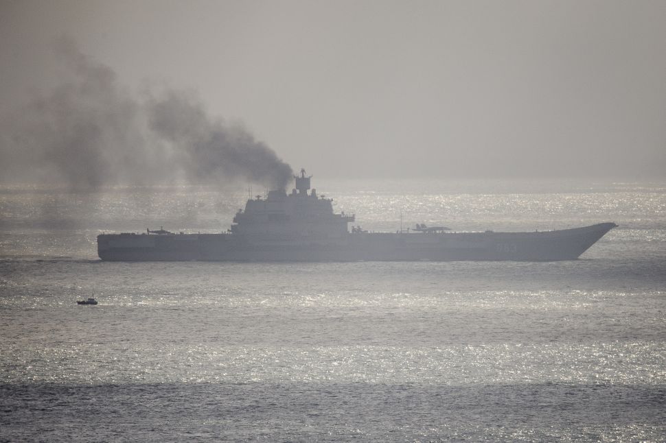 DOVER, ENGLAND - OCTOBER 21: The Russian aircraft carrier Admiral Kuznetsov passes through the English channel on October 21, 2016 near Dover, England. The Russian Navy's flotilla of warships is presumed to be heading to the eastern Mediterranean to support the Russian military's current deployment in Syria.