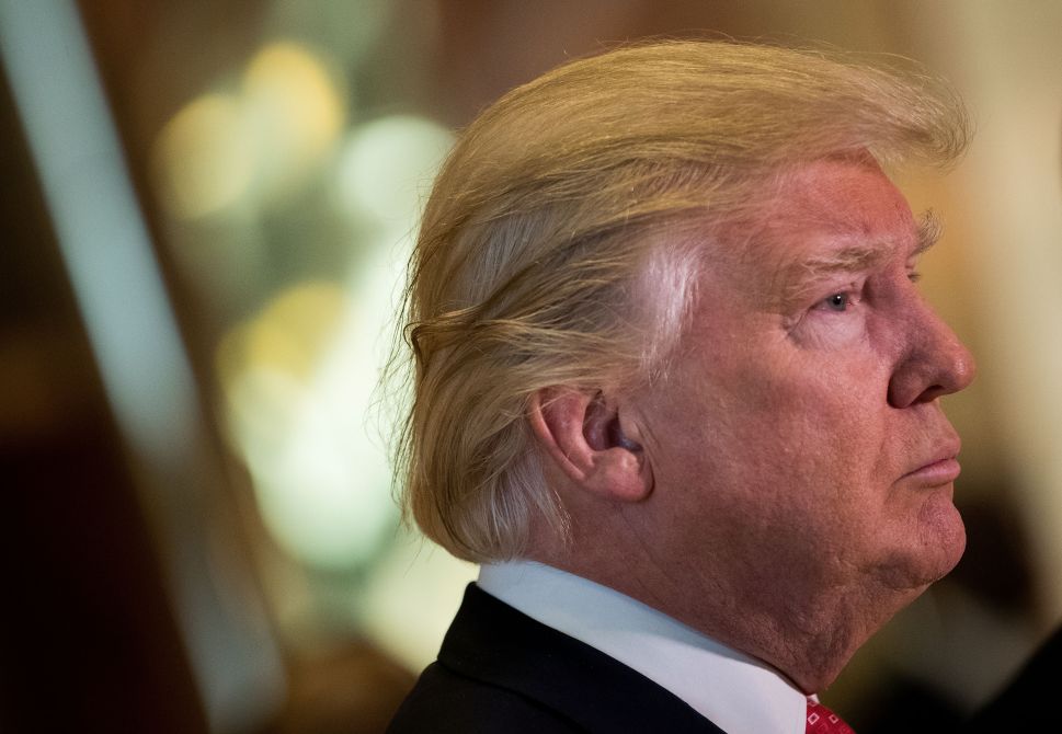 NEW YORK, NY - JANUARY 9: President-elect Donald Trump speaks to reporters in the lobby after meeting with French businessman Bernard Arnault, chief executive officer of LVMH, at Trump Tower, January 9, 2017 in New York City. President-elect Donald Trump and his transition team are in the process of filling cabinet and other high level positions for the new administration.