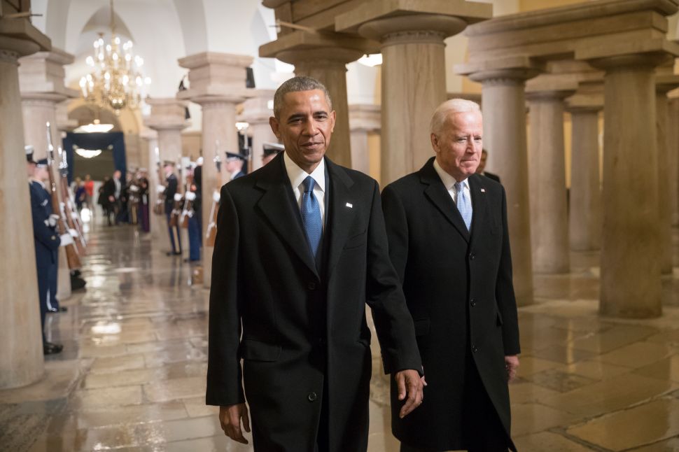 WASHINGTON, DC - JANUARY 20: President Barack Obama and Vice President Joe Biden walk through the Crypt of the Capitol for Donald Trump's inauguration ceremony, in Washington, January 20, 2017.
