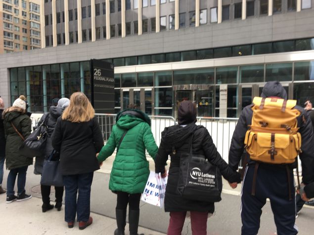 New Yorkers form a human chain in front of the Jacob K. Javits Federal Building after President Donald Trump signed an executive order calling for a Muslim immigration ban.