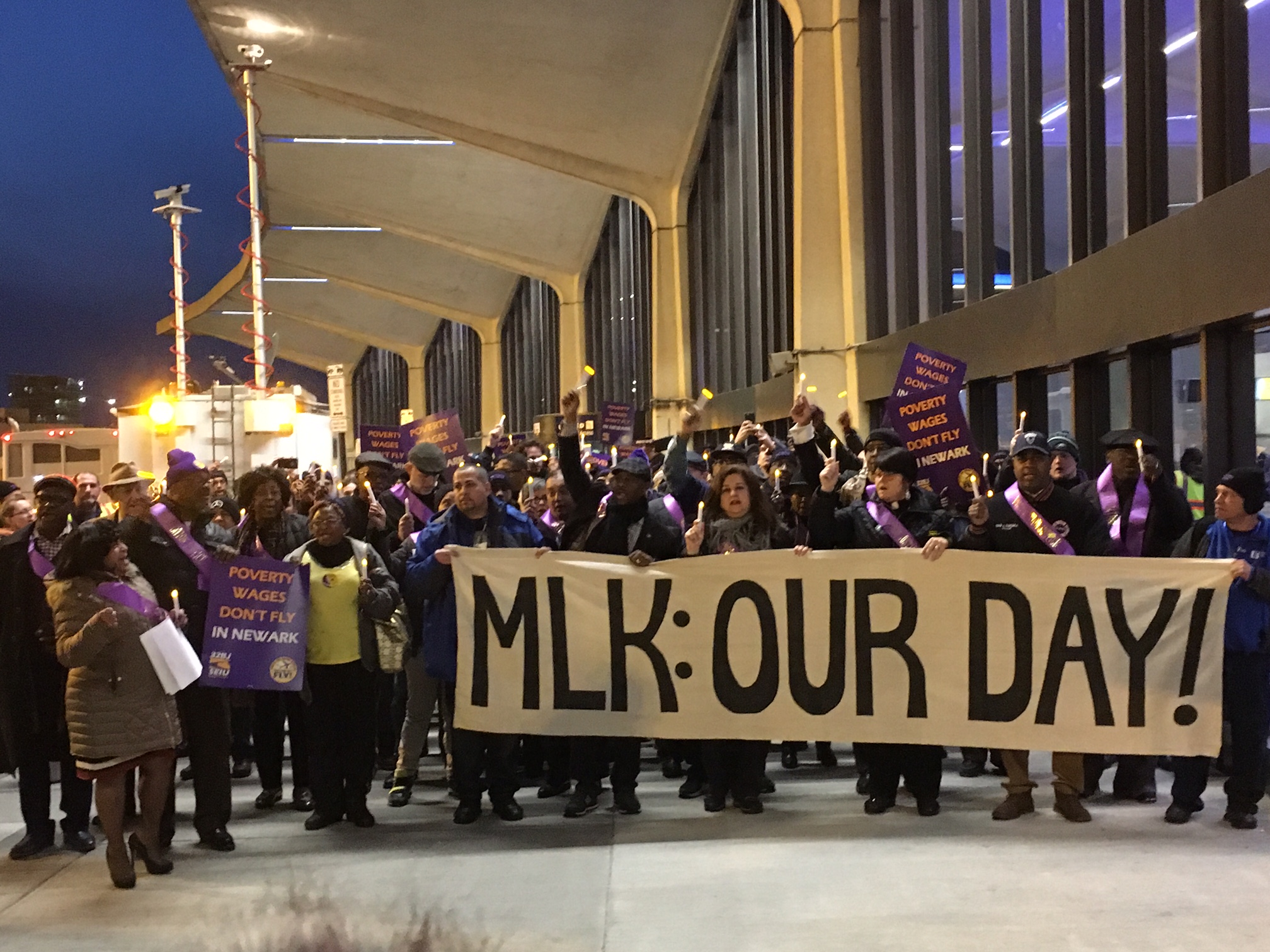 Airport workers rally for a higher minimum wage.