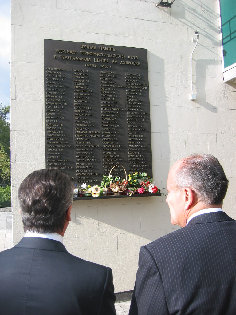 In Sept, 2004, Rudy Giuliani visited the memorial to the victims of the 2002 Nord-Ost siege at a theater in Moscow. Note the presence of a security camera above the plaque listing the victims.