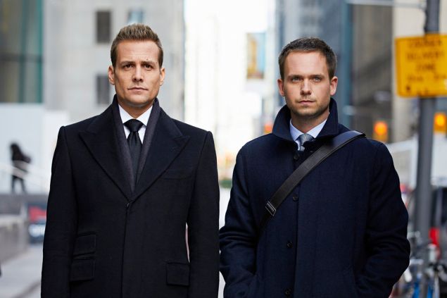 Gabriel Macht as Harvey Specter and Patrick J. Adams as Michael Ross.