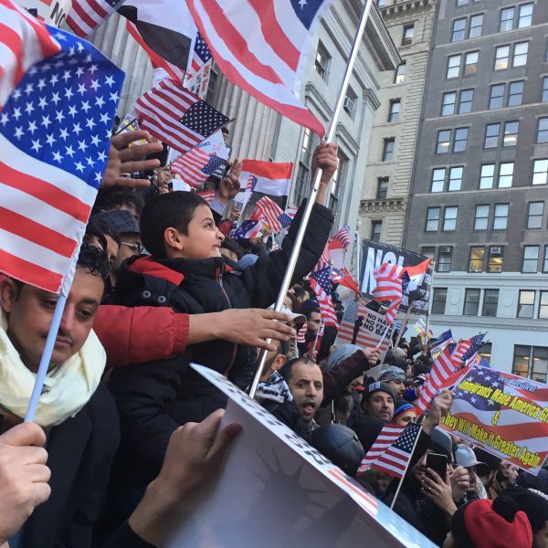 A young boy chants "USA!" enthusiastically at the Yemeni bodega owner rally against President Donald Trump's Muslim travel ban.