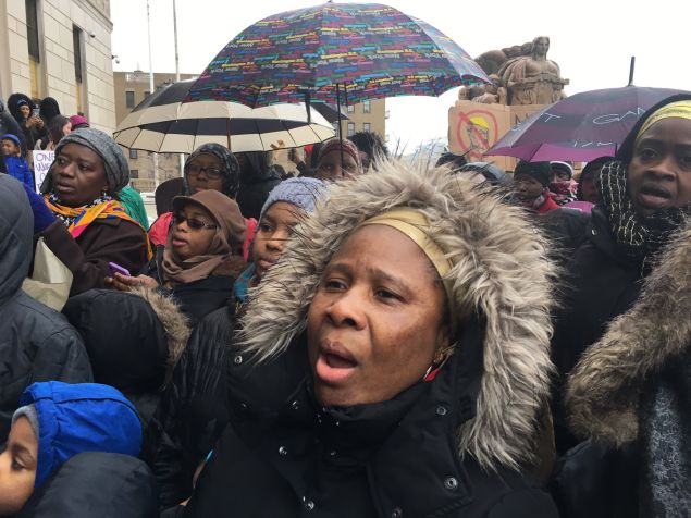 African Muslim women outside the Bronx County Courthouse protest against President Donald Trump at a Muslim and Immigrant Coalition for Justice rally today.