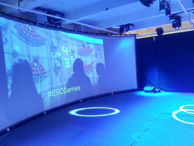 The giant screen, showing a video about the games, not a game.