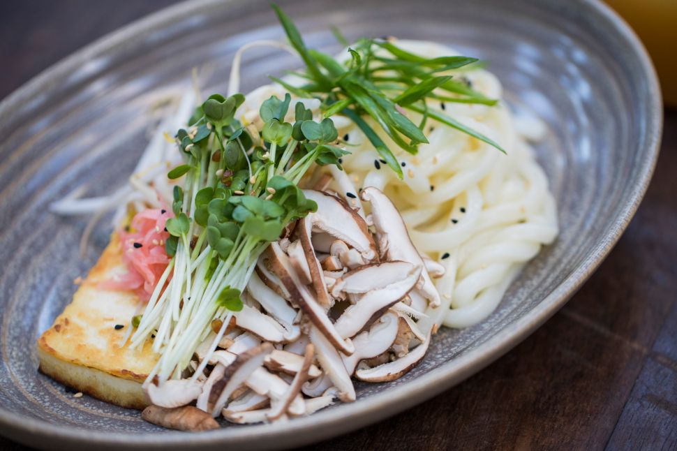 Warm broth is poured over this bowl of udon for Estrella's Compass Menu.