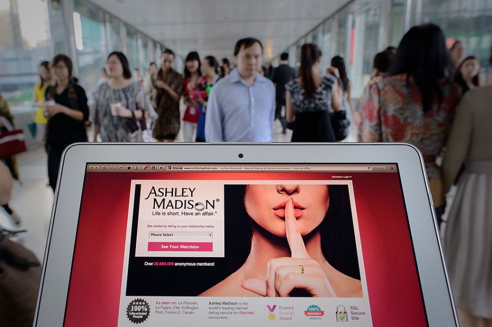 The Ashley Madison dating website displayed on a laptop in Hong Kong.