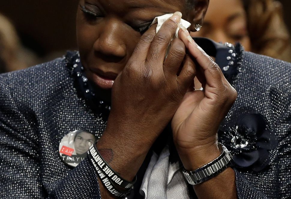 Sybrina Fulton, mother of Trayvon Martin, wipes her eyes during a Senate Judiciary Committee hearing on "Stand Your Ground" laws October 29, 2013 in Washington, DC.
