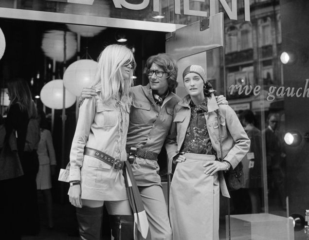 Yves Saint Laurent, with Betty Catroux (left) and Loulou de la Falaise, outside his 'Rive Gauche' shop. 