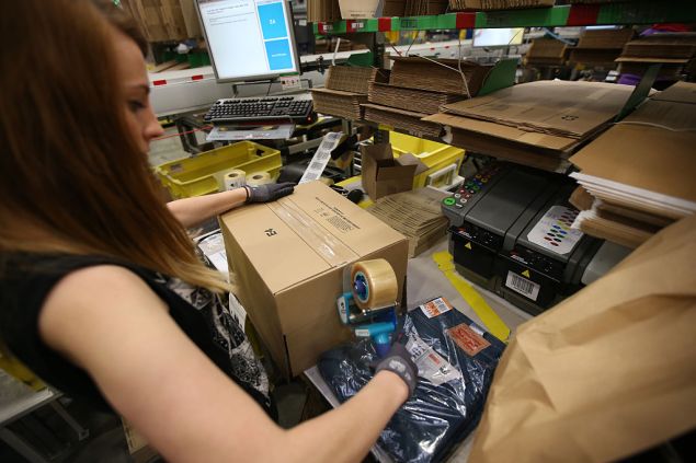 HEMEL HEMPSTEAD, ENGLAND - DECEMBER 05: A parcel is prepared for dispatch at Amazon's warehouse on December 5, 2014 in Hemel Hempstead, England. In the lead up to Christmas, Amazon is experiencing the busiest time of the year. (Photo by Peter Macdiarmid/Getty Images)