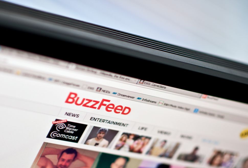 The logo of news website BuzzFeed is seen on a computer screen in Washington on March 25, 2014. AFP PHOTO/Nicholas KAMM 
