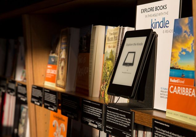 SEATTLE, WA - NOVEMBER 4: Books are displayed along side an Amazon Kindle device, which offers previews of those same books on nearby shelves at the Amazon Books store on November 4, 2015 in Seattle, Washington. The online retailer opened its first brick-and-mortar book store on November 3, 2015. (Photo by Stephen Brashear/Getty Images)