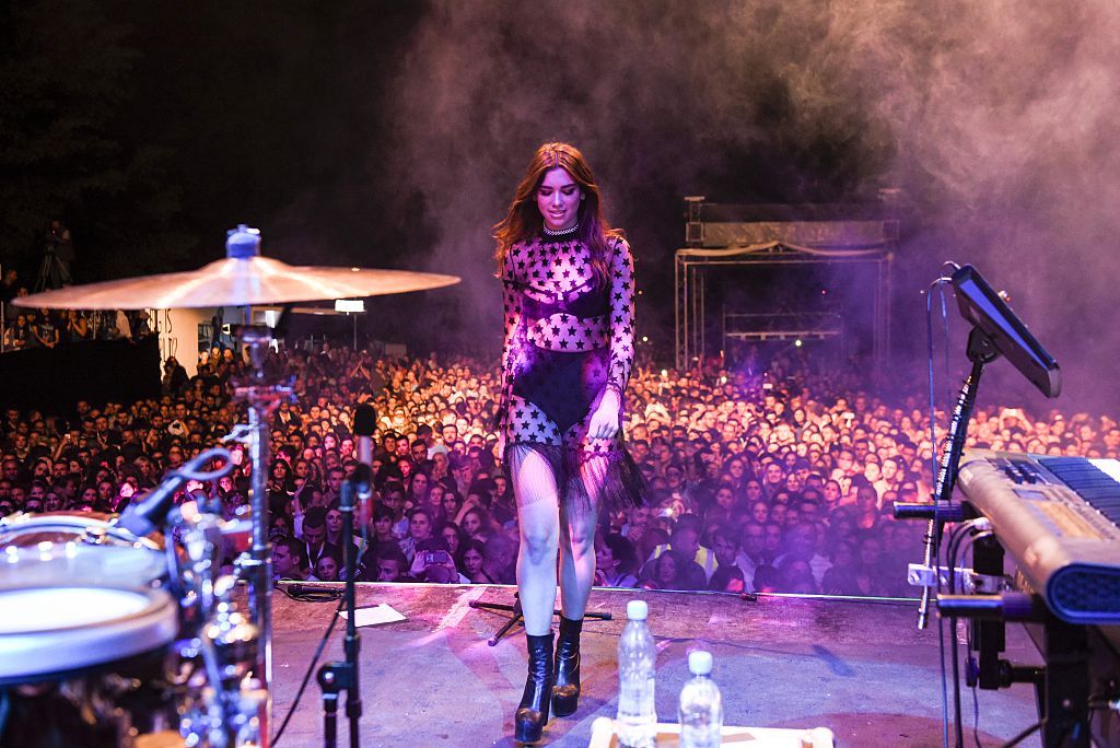British-Kosovan singer Dua Lipa performs on stage during her first concert held in her hometown Pristina, at the Germia National Park, on August 9, 2016, gathering more than twenty thousands people. Dua was born in London on 22 August 1995 to ethnic Albanian parents from Kosovo who had left Pristina in the 1990s. / AFP / ARMEND NIMANI (Photo credit should read ARMEND NIMANI/AFP/Getty Images)