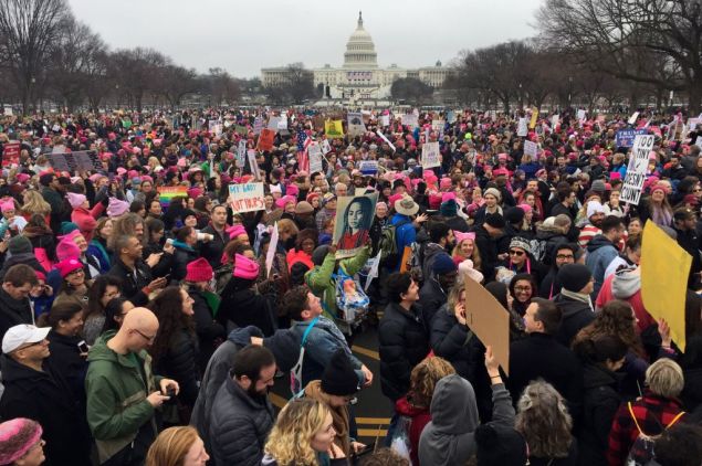 Demonstrators protest on the National Mall in Washington, DC, for the Women's march on January 21, 2017. Hundreds of thousands of protesters spearheaded by women's rights groups demonstrated across the US to send a defiant message to US President Donald Trump.