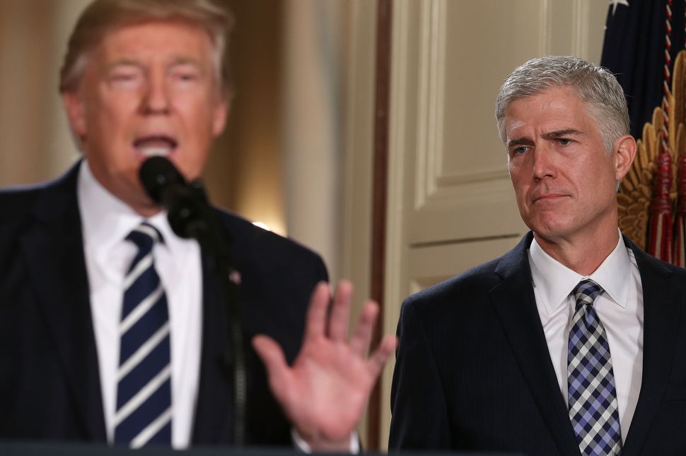 Judge Neil Gorsuch listens as President Donald Trump nominates him to the Supreme Court during a ceremony in the East Room of the White House on January 31, 2017.