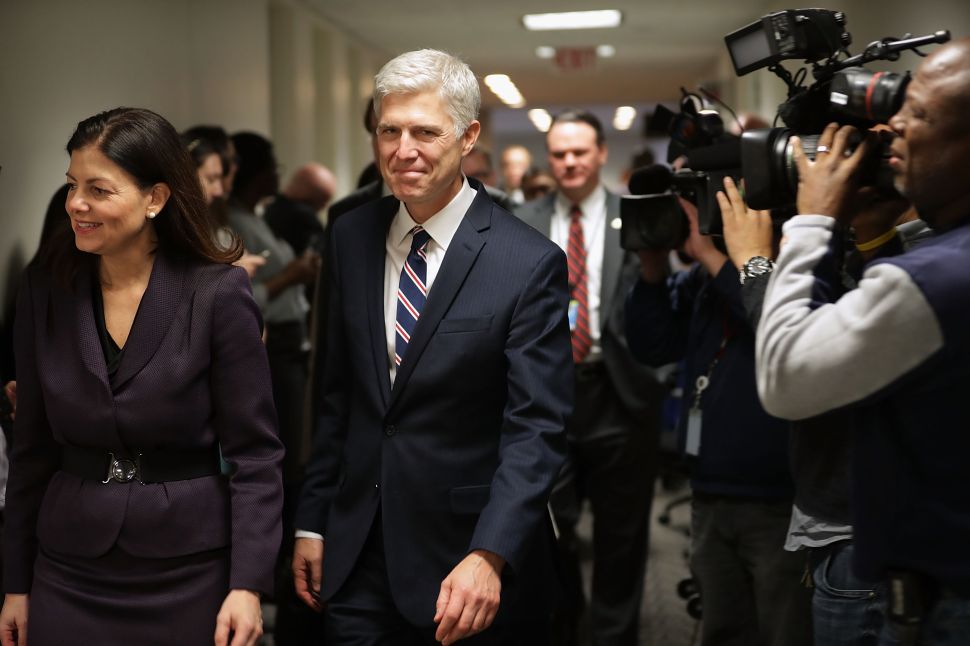 WASHINGTON, DC - FEBRUARY 01: Supreme Court nominee Judge Neil Gorsuch (C) is accompanied by former Republican Sen. Kelly Ayotte (L) as they arrive for a meeting at the office of Sen. Joe Manchin (D-WV) in the Hart Senate Office Building on Capitol Hill February 1, 2017 in Washington, DC. President Donald Trump nominated Judge Gorsuch to the Supreme Court to fill the seat left vacant with the death of Associate Justice Antonin Scalia in February 2016.