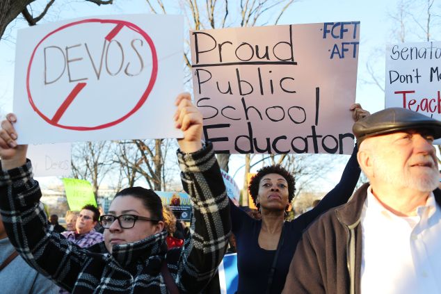Protestors demonstrate against President Trump's nominee for secretary of education, Betsy DeVos, on Capitol Hill on February 6, 2017 in Washington, DC.