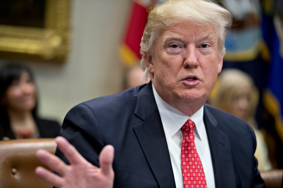 WASHINGTON, DC - FEBRUARY 7: (AFP OUT) U.S. President Donald Trump speaks as he meets with county sheriffs during a listening session in the Roosevelt Room of the White House on February 7, 2017 in Washington, DC. The Trump administration will return to court Tuesday to argue it has broad authority over national security and to demand reinstatement of a travel ban on seven Muslim-majority countries that stranded refugees and triggered protests.