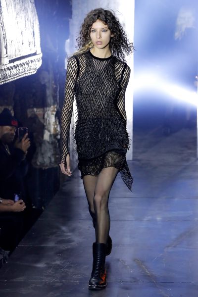 A black on black fishnet dress.