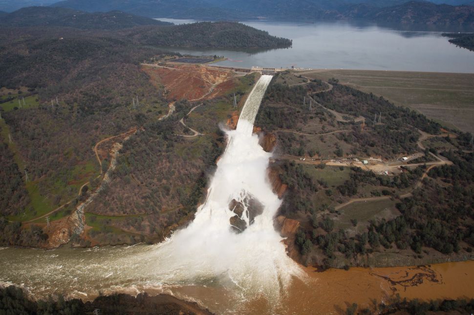 Oroville lake, the emergency spillway, and the damaged main spillway, are seen from the air on February 13, 2017 in Oroville, California. Almost 200,000 people were ordered to evacuate the northern California town after a hole in an emergency spillway in the Oroville Dam threatened to flood the surrounding area.