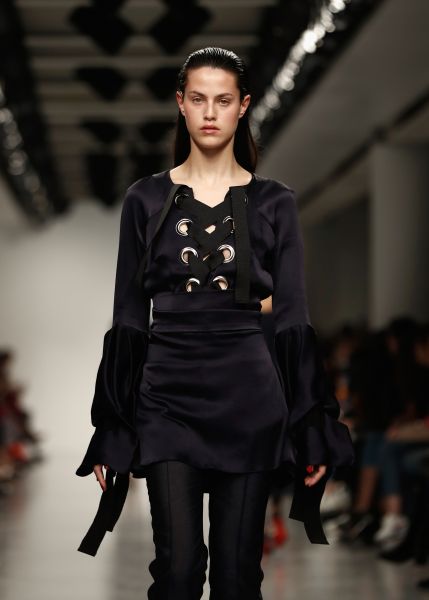 A model walks the runway at the Teatum Jones show during the London Fashion Week