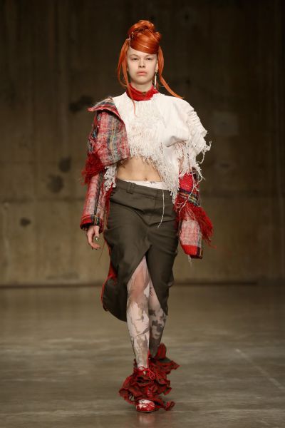 A model walks the runway at the ASAI (Fashion East) show during LFW