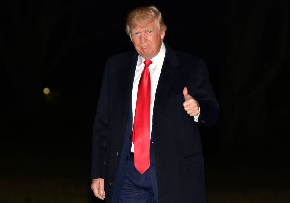 WASHINGTON, DC - FEBRUARY 20: U.S.President Donald Trump gives a thumbs up to the media on his return to the White House on President's Day February 20, 2017 in Washington, DC. The president was returning from a long weekend at his Mar-a-Lago estate in Florida.