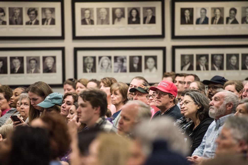 People listen to Sen. Tim Scott during a town hall meeting on February 25, 2017 in North Charleston, SC. Protestors have been showing up in large numbers to congressional town hall meetings across the nation.
