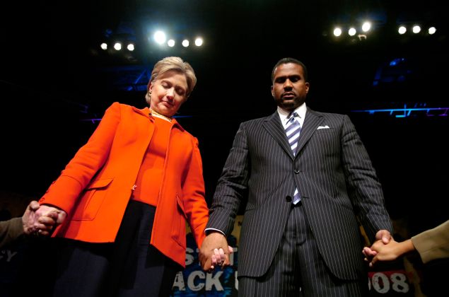  Democratic presidential hopeful Sen. Hillary Clinton (D-NY) with television talk show host Tavis Smiley hold hands with members of the crowd at the "State Of The Black Union" symposium at the Ernest E. Morial Convention Center February 23, 2008 in New Orleans, Louisiana. 