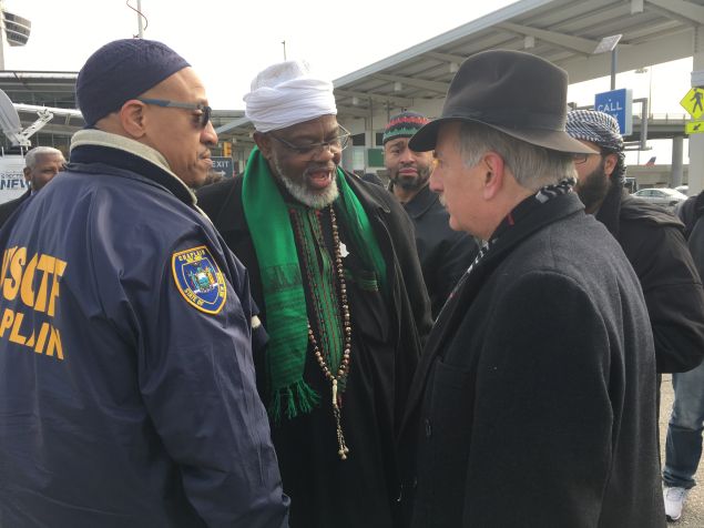 Queens Assemblyman David Weprin chats with Imam Al-Hajj Talib 'Abdur-Rashid of the Mosque of Islamic Brotherhood after an interfaith action at John F. Kennedy International Airport's Terminal 4 Arrivals area.
