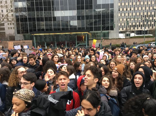 Hundreds of high school students standing in Foley Square. They skipped school today to protest against Donald Trump.