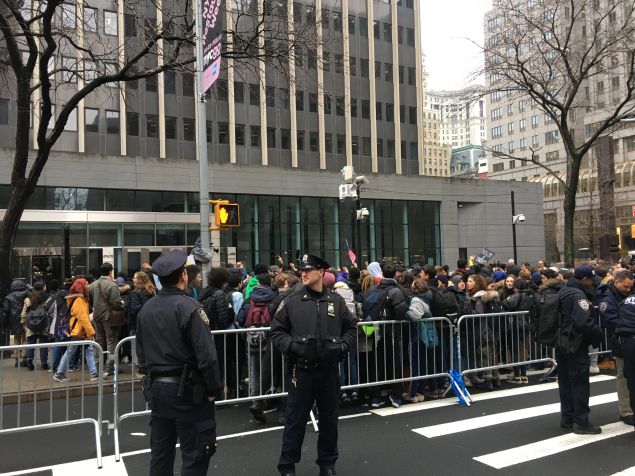 High school students gather in front of 26 Federal Plaza to protest against Donald Trump.