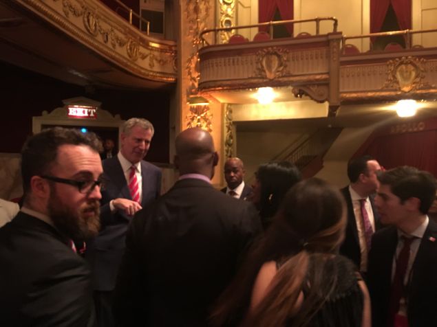 Mayor Bill de Blasio meets with attendees after his State of the City speech at the Apollo Theater in Harlem.