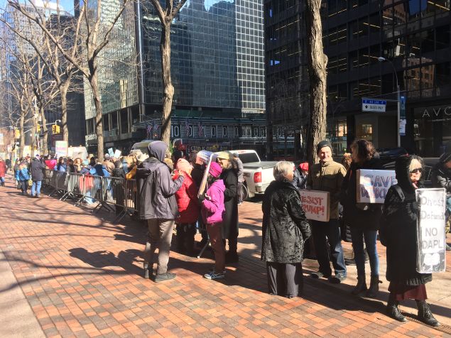 MoveOn.org members protest outside of Senate Minority Leader Charles Schumer's office.